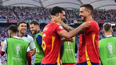 Spain's midfielder #06 Mikel Merino celebrates with teammates after scoring his team's second goal during the UEFA Euro 2024 quarter-final football match between Spain and Germany at the Stuttgart Arena in Stuttgart on July 5, 2024. (Photo by Tobias SCHWARZ / AFP)