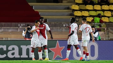 Monaco's French forward Wissam Ben Yedder (L) celebrates with teammates after scoring a penalty kick during the UEFA Europa League group H football match between AS Monaco and Trabzonspor at the Louis II Stadium (Stade Louis II) in the Principality of Monaco on October 6, 2022. (Photo by Valery HACHE / AFP)