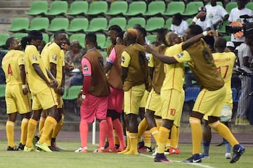 Zimbabwe's players celebrate scoring against Algeria