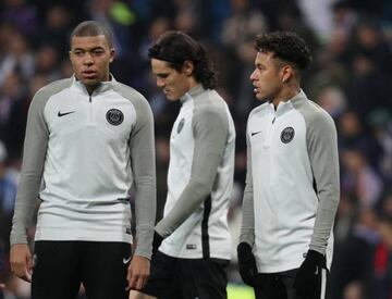 Paris Saint-Germain’s Kylian Mbappé, Edinson Cavani and Neymar warm up before Wednesday's Champions League match against Real Madrid.