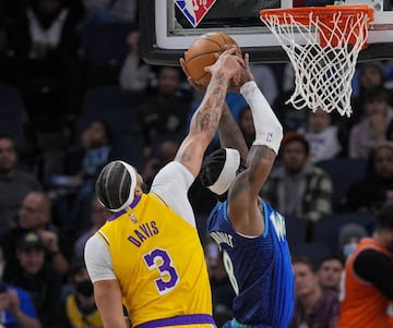 Dec 17, 2021; Minneapolis, Minnesota, USA; Los Angeles Lakers forward Anthony Davis (3) blocks Minnesota Timberwolves forward Jarred Vanderbilt (8) in the first quarter at Target Center. Mandatory Credit: Brad Rempel-USA TODAY Sports