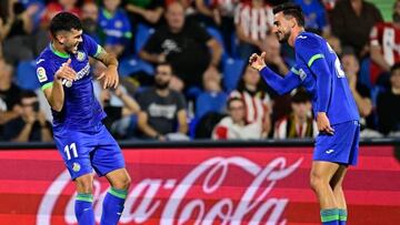 Getafe's Spanish midfielder Carles Alena (L) celebrates with Getafe's Spanish defender Juan Iglesias after scoring his team's first goal during the Spanish League football match between Getafe CF and Athletic Club Bilbao at the Col. Alfonso Perez stadium in Getafe on October 18, 2022. (Photo by JAVIER SORIANO / AFP) (Photo by JAVIER SORIANO/AFP via Getty Images)