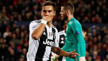 Soccer Football - Champions League - Group Stage - Group H - Manchester United v Juventus - Old Trafford, Manchester, Britain - October 23, 2018 Juventus' Paulo Dybala celebrates scoring their first goal as Manchester United's David de Gea reacts Action I