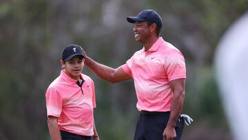 ORLANDO, FLORIDA - DECEMBER 17: Tiger Woods of the United States and son Charlie Woods celebrate on the seventh green during the first round of the PNC Championship at Ritz-Carlton Golf Club on December 17, 2022 in Orlando, Florida.   Mike Ehrmann/Getty Images/AFP (Photo by Mike Ehrmann / GETTY IMAGES NORTH AMERICA / Getty Images via AFP)