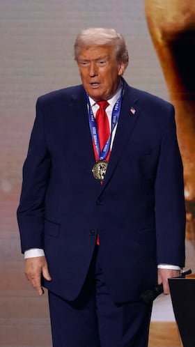Dec 5, 2025; Washington, District of Columbia, USA; FIFA president Gianni Infantino presents United States President Donald Trump with the FIFA Peace Prize during the FIFA World Cup 2026 Final Draw at John F. Kennedy Center for the Performing Arts. Mandatory Credit: Amber Searls-Imagn Images