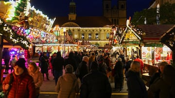 People attend the opening day of the Magdeburg Christmas market, where, on December 20, 2024, a suspect drove a car into a crowd, in Magdeburg, Germany, November 20, 2025. REUTERS/Christian Mang