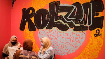 Women wear protective masks as they wait for a coronavirus-shaped ice cream inside Roll Zone shop after months of lockdown, following the outbreak of the coronavirus disease (COVID-19), in the Cairo neighborhood of Giza, Egypt June 28, 2020. Picture taken