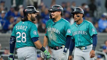 Oct 13, 2025; Toronto, Ontario, CAN; Seattle Mariners infielder Josh Naylor (12) celebrates a two run home run in the seventh inning against the Toronto Blue Jays during game two of the ALCS round for the 2025 MLB playoffs at Rogers Centre. Mandatory Credit: Nick Turchiaro-Imagn Images