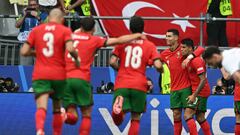 Portugal's forward #07 Cristiano Ronaldo (2R) celebrates with teammates after setting up the third goal for Portugal's midfielder #08 Bruno Fernandes during the UEFA Euro 2024 Group F football match between Turkey and Portugal at the BVB Stadion in Dortmund on June 22, 2024. (Photo by OZAN KOSE / AFP)