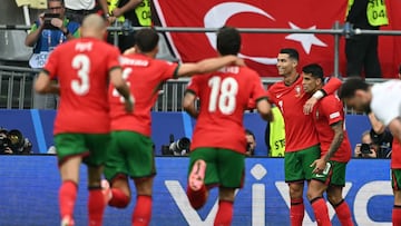 Portugal's forward #07 Cristiano Ronaldo (2R) celebrates with teammates after setting up the third goal for Portugal's midfielder #08 Bruno Fernandes during the UEFA Euro 2024 Group F football match between Turkey and Portugal at the BVB Stadion in Dortmund on June 22, 2024. (Photo by OZAN KOSE / AFP)