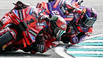 Ducati Lenovo Team's Italian rider Francesco Bagnaia (L) and Prima Pramac Racing's Spanish rider Jorge Martin compete during the MotoGP Malaysian Grand Prix at the Sepang International Circuit in Sepang on November 3, 2024. (Photo by MOHD RASFAN / AFP)
