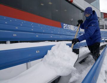 Dec 10, 2017; Orchard Park, NY, USA; Stadium personnel shovels off seats at New Era Field before a game between the Buffalo Bills and the Indianapolis Colts. Mandatory Credit: Timothy T. Ludwig-USA TODAY Sports