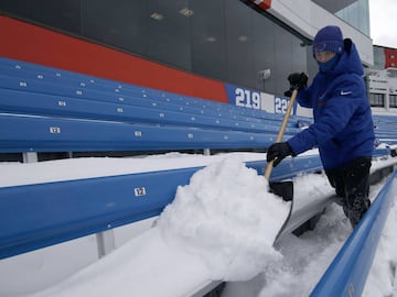 Dec 10, 2017; Orchard Park, NY, USA; Stadium personnel shovels off seats at New Era Field before a game between the Buffalo Bills and the Indianapolis Colts. Mandatory Credit: Timothy T. Ludwig-USA TODAY Sports