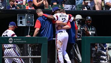 CHICAGO, ILLINOIS - MAY 29: Tim Anderson #7 of the Chicago White Sox is helped off the field by medical staff after an apparent injury in the fifth inning against the Chicago Cubs at Guaranteed Rate Field on May 29, 2022 in Chicago, Illinois. (Photo by Quinn Harris/Getty Images)