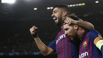 (FILES) In this file photo taken on March 13, 2019 Barcelona's Argentinian forward Lionel Messi (R) celebrates with Barcelona's Uruguayan forward Luis Suarez after scoring during the UEFA Champions League round of 16, second leg football match b