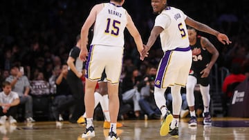 LOS ANGELES, CALIFORNIA - NOVEMBER 12: Austin Reaves #15 and Cam Reddish #5 of the Los Angeles Lakers slap hands during the first half against the Portland Trail Blazers at Crypto.com Arena on November 12, 2023 in Los Angeles, California. NOTE TO USER: User expressly acknowledges and agrees that, by downloading and or using this photograph, User is consenting to the terms and conditions of the Getty Images License Agreement.   Meg Oliphant/Getty Images/AFP (Photo by Meg Oliphant / GETTY IMAGES NORTH AMERICA / Getty Images via AFP)