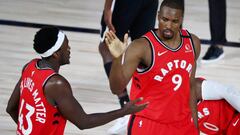 Aug 21, 2020; Lake Buena Vista, Florida, USA; Toronto Raptors center Serge Ibaka (9) is congratulated by forward Pascal Siakam (43) after making a three point basket against the Brooklyn Nets during the first half in game three of the first round of the 2020 NBA Playoffs at The Field House. Mandatory Credit: Kim Klement-USA TODAY Sports
