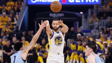 Golden State Warriors guard Stephen Curry (C) passes as Memphis Grizzlies guard Scotty Pippen Jr. (L) and Memphis Grizzlies center Zach Edey (R) defend during the first half of the NBA Play-In Tournament game between the Memphis Grizzlies and the Golden State Warriors in San Francisco, California, USA, 15 April 2025.