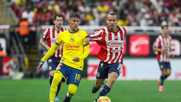 Cristian Calderon (L) of America fights for the ball with Fernando Gonzalez (R) of Guadalajara during the 11th round match between Guadalajara and America as part of the Liga BBVA MX, Torneo Clausura 2025 at Akron Stadium, on March 08, 2025 in Guadalajara, Jalisco, Mexico.
