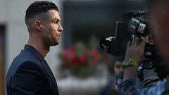 Portugal's forward #07 Cristiano Ronaldo speaks to journalists as he and his teammates arrive at their hotel at their base camp in Harsewinkel, on June 13, 2024, ahead of the UEFA Euro 2024 football championship. (Photo by PATRICIA DE MELO MOREIRA / AFP)