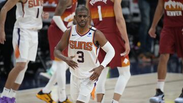 Phoenix Suns guard Chris Paul, front, reacts after hitting a basket late in the second half of Game 4 of an NBA second-round playoff series against the Denver Nuggets, Sunday, June 13, 2021, in Denver. Phoenix won 125-118 to sweep the series. (AP Photo/David Zalubowski)