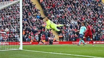 Number 30. Mohamed Salah beats Bournemouth's Asmir Begovic with a looping header at Anfield.