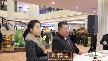 North Korean leader Kim Jong Un and his daughter Kim Ju Ae stand at a hotel reception counter as they attend an inauguration ceremony for hotels in the tourist resort in Samjiyon City, North Korea, December 20, 2025, in this picture released by North Korea's official Korean Central News Agency. KCNA via REUTERS ATTENTION EDITORS - THIS IMAGE WAS PROVIDED BY A THIRD PARTY. REUTERS IS UNABLE TO INDEPENDENTLY VERIFY THIS IMAGE. NO THIRD PARTY SALES. SOUTH KOREA OUT. NO COMMERCIAL OR EDITORIAL SALES IN SOUTH KOREA.