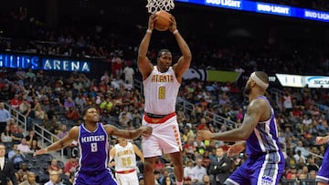 Oct 31, 2016; Atlanta, GA, USA; Atlanta Hawks center Dwight Howard (8) controls a rebound between Sacramento Kings forward Rudy Gay (8) and center DeMarcus Cousins (15) during the second half at Philips Arena. The Hawks defeated the Kings 106-95. Mandatory Credit: Dale Zanine-USA TODAY Sports