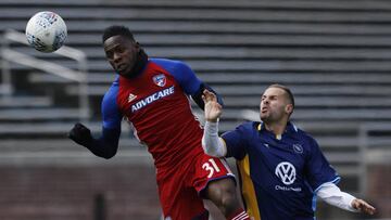 FC Dallas' Maynor Figueroa, left, heads the ball against Chattanooga FC's Joao Costa during an exhibition soccer match against at Finley Stadium, Saturday, Feb. 3, 2018, in Chattanooga, Tenn. CFC, a National Premiere Soccer League team of amateur players, held the MLS team FC Dallas to a 1-1 draw. (Doug Strickland/Chattanooga Times Free Press via AP)