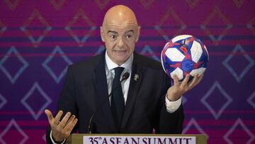 FIFA president Gianni Infantino holds a soccer ball during a speech to signing of memorandum of understanding between The ASEAN and FIFA in Nonthaburi, Thailand, Saturday, Nov. 2, 2019. (AP Photo/Sakchai Lalit)