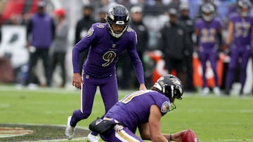 BALTIMORE, MARYLAND - OCTOBER 02: Justin Tucker #9 of the Baltimore Ravens attempts a field goal as Jordan Stout #11 holds in the second quarter against the Buffalo Bills at M&T Bank Stadium on October 02, 2022 in Baltimore, Maryland. Rob Carr/Getty Images/AFP