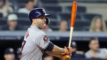 May 8, 2024; Bronx, New York, USA; Houston Astros second baseman Jose Altuve (27) follows through on an RBI single against the New York Yankees during the ninth inning at Yankee Stadium. Mandatory Credit: Brad Penner-USA TODAY Sports