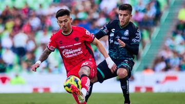 Diego Gonzalez (L) of Atlas fights for the ball kith Emmanuel Echeverria (R) of Santos during the 8th round match between Santos and Atlas as part of the Liga BBVA MX, Torneo Clausura 2025 at TSM Corona Stadium, on February 23, 2025 in Torreon, Coahuila, Mexico.