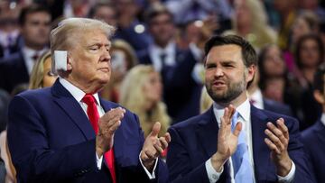 Republican presidential nominee and former U.S. President Donald Trump applauds with Republican vice presidential nominee J.D. Vance during Day 1 of the Republican National Convention (RNC) at the Fiserv Forum in Milwaukee, Wisconsin, U.S., July 15, 2024. REUTERS/Andrew Kelly