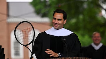 Former Swiss tennis player Roger Federer holds a tennis racket as he speaks to students during commencement ceremonies at Dartmouth in Hanover, New Hampshire, U.S. June 9, 2024. REUTERS/Ken McGagh
