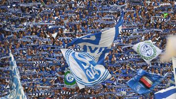 Schalke supporters cheer their team during the German first division Bundesliga football match FC Schalke 04 vs Hertha Berlin