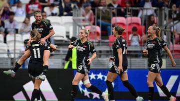 Arsenal's players celebrate after scoring their second goal during the UEFA Women's Champions League semi-final second leg football match between Lyon and Arsenal at the Groupama Stadium in Decines-Charpieu, central-eastern France on April 27, 2025. (Photo by OLIVIER CHASSIGNOLE / AFP)