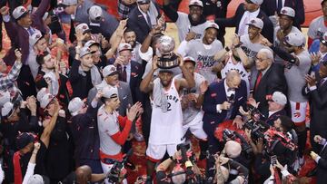 TORONTO, ON- MAY 25 - Toronto Raptors forward Kawhi Leonard (2) holds up the trophy as the Toronto Raptors play the Milwaukee Bucks in game six of the NBA Eastern Conference Final in Toronto. May 25, 2019. (Steve Russell/Toronto Star via Getty Images)