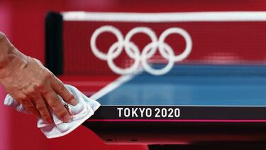 TOKYO, JAPAN - JULY 19: A worker disinfects a table tennis court ahead of the 2020 Tokyo Summer Olympic Games at Tokyo Metropolitan Gymnasium on July 19, 2021 in Tokyo, Japan. (Photo by Steph Chambers/Getty Images)