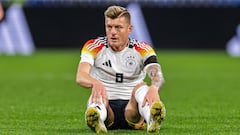 LYON, FRANCE - MARCH 23: Toni Kroos of Germany sits on the pitch during the international friendly match between France and Germany at Groupama Stadium on March 23, 2024 in Lyon, France. (Photo by Boris Streubel/Getty Images)