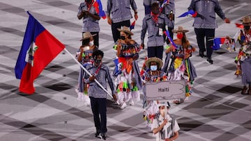 Tokyo 2020 Olympics - The Tokyo 2020 Olympics Opening Ceremony - Olympic Stadium, Tokyo, Japan - July 23, 2021. Flag bearers Sabiana Anestor of Haiti and Darrelle Valsaint Jr of Haiti lead their contingent during the athletes parade at the opening ceremon