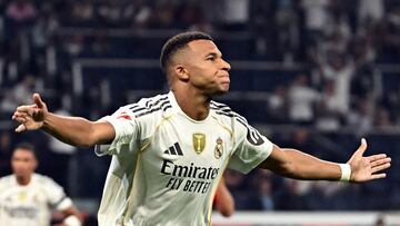 Real Madrid's French forward #10 Kylian Mbappe celebrates scoring the opening goal from the penalty spot during the Spanish league football match between Real Madrid CF and CA Osasuna at Santiago Bernabeu Stadium in Madrid on August 19, 2025. (Photo by Javier SORIANO / AFP)
