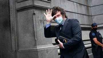 Lawmaker Javier Milei waves as he arrives to the Argentine Congress before a special session to address the agreement between Argentine government and the International Monetary Fund in Buenos Aires on March 10, 2022. (Photo by MARCOS BRINDICCI / AFP) (Photo by MARCOS BRINDICCI/AFP via Getty Images)