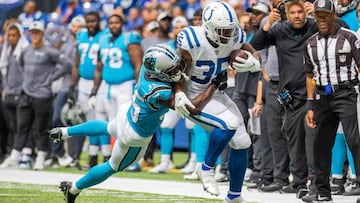 Indianapolis Colts running back Deon Jackson (35) runs the ball while Carolina Panthers defensive back Jalen Julius (35) defends  in the second half at Lucas Oil Stadium. 