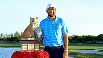 Scottie Scheffler of the United States poses with the trophy