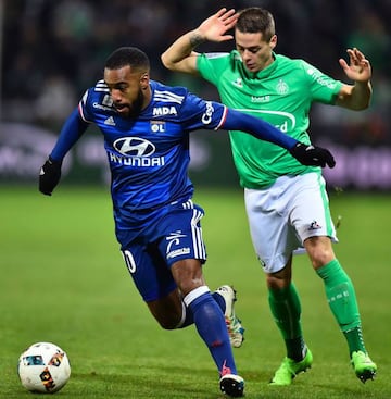 Lyon's French forward Alexandre Lacazette vies with Saint-Etienne's French forward Romain Hamouma.