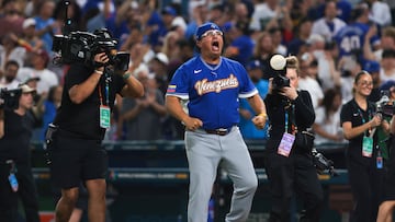 Mar 14, 2026; Miami, FL, United States; Venezuela manager Omar Lopez (22) celebrates after winning the quarterfinal game of the 2026 World Baseball Classic against Japan at loanDepot Park. Mandatory Credit: Sam Navarro-Imagn Images