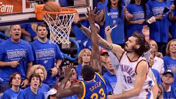 May 28, 2016; Oklahoma City, OK, USA; Oklahoma City Thunder center Steven Adams (12) dunks over Golden State Warriors forward Draymond Green (23) during the second quarter in game six of the Western conference finals of the NBA Playoffs at Chesapeake Energy Arena. Mandatory Credit: Mark D. Smith-USA TODAY Sports