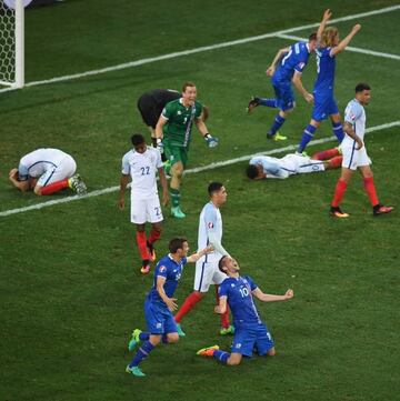 Gylfi Sigurdsson of Iceland falls to his knees in celebration as his team knock out England in the UEFA Euro 2016 Round of 16