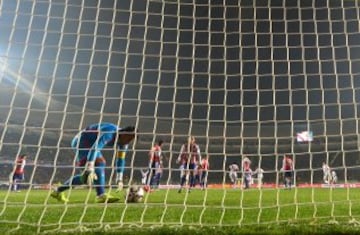 Paraguay's goalkeeper Justo Villar picks up the ball after being scored on during the Copa America third place football match against Peru in Concepcion, Chile on July 3, 2015. AFP PHOTO / LUIS ACOSTA